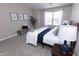 Bright bedroom with a plush bed, neutral tones, and serene artwork, offering a peaceful and stylish retreat at 12678 Brewton St, Fishers, IN 46038