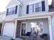 Charming two-story home featuring a cozy front porch and attached one-car garage at 12678 Brewton St, Fishers, IN 46038