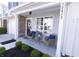 Inviting front porch with chairs and table, perfect for relaxing outdoors at 12678 Brewton St, Fishers, IN 46038