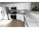 Well-equipped kitchen with stainless steel appliances, light countertops, and white cabinets at 12678 Brewton St, Fishers, IN 46038