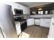 Modern kitchen with stainless steel appliances, white cabinets, and concrete countertops at 12678 Brewton St, Fishers, IN 46038