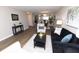 Bright living room with wood flooring, an area rug, and modern decor at 12678 Brewton St, Fishers, IN 46038