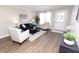 Open-concept living room with elegant decor and lots of natural light at 12678 Brewton St, Fishers, IN 46038