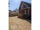 A spacious backyard with a wooden deck, perfect for outdoor entertaining and relaxation at 128 W Walnut St, Lebanon, IN 46052