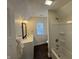 Bright bathroom featuring a shower and tub combination with modern fixtures and a spacious white vanity at 128 W Walnut St, Lebanon, IN 46052