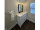 This bathroom features a modern vanity with sleek hardware, a towel bar, and a framed mirror above the sink at 128 W Walnut St, Lebanon, IN 46052