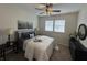 Comfortable bedroom featuring neutral paint, a bed, night stands and plenty of natural light from the window at 128 W Walnut St, Lebanon, IN 46052