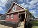Charming red two-story home with a cozy front porch and newly landscaped garden at 128 W Walnut St, Lebanon, IN 46052