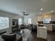 Inviting living space with hardwood floors, bright windows, and views into a modern kitchen at 128 W Walnut St, Lebanon, IN 46052