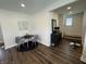 Cozy dining area with modern decor flows seamlessly into a hallway and stairway at 128 W Walnut St, Lebanon, IN 46052