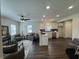 Spacious living area with hardwood floors, connecting kitchen, and bright natural light at 128 W Walnut St, Lebanon, IN 46052