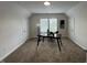 Large office space with ample natural light, neutral paint, carpet flooring, and an elegant modern desk at 128 W Walnut St, Lebanon, IN 46052