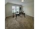 Spacious office area featuring natural light, neutral walls, carpet flooring, and a sleek workspace at 128 W Walnut St, Lebanon, IN 46052