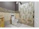 Well-lit bathroom featuring tile, patterned shower curtain, and modern fixtures at 12820 University Cres # 3D, Carmel, IN 46032
