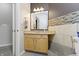 This bathroom has granite countertops, wood cabinets, and a stylish mirror at 12820 University Cres # 3D, Carmel, IN 46032