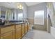 Bathroom featuring double vanity, tile floor, tub and shower, and contemporary fixtures at 12820 University Cres # 3D, Carmel, IN 46032