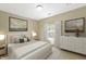 Relaxing bedroom featuring neutral colors, a large window, and stylish décor at 12820 University Cres # 3D, Carmel, IN 46032