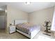 Clean bedroom with carpet, white bed frame, and neutral colored walls with natural light at 12820 University Cres # 3D, Carmel, IN 46032