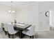 Inviting dining room with stylish decor, comfortable seating, and soft, neutral color palette at 12820 University Cres # 3D, Carmel, IN 46032