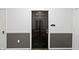 A close-up of a dark brown apartment door with unit number, set against neutral-toned walls at 12820 University Cres # 3D, Carmel, IN 46032