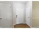 Bright and airy entryway with neutral walls and trim, featuring a secure keyless entry system at 12820 University Cres # 3D, Carmel, IN 46032