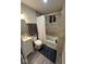 Well-lit bathroom with tub, shower, modern vanity, and complementary neutral tones at 137 S 2Nd Ave, Beech Grove, IN 46107