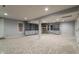 Finished basement featuring built in shelving and windows at 13797 Mill Stream Ct, Carmel, IN 46032