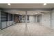 Finished basement with neutral walls, carpeting and built in shelving at 13797 Mill Stream Ct, Carmel, IN 46032