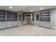Finished basement featuring custom built-in shelving, cabinets, and neutral carpeting at 13797 Mill Stream Ct, Carmel, IN 46032