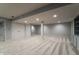 Finished basement with neutral walls, carpeting, storage, and access to other rooms at 13797 Mill Stream Ct, Carmel, IN 46032