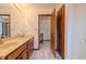 Bathroom features a double vanity and an open doorway to the hallway at 13797 Mill Stream Ct, Carmel, IN 46032