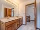 Bathroom with a double vanity, and an open doorway to the upstairs at 13797 Mill Stream Ct, Carmel, IN 46032