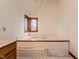 Soaking tub with a window view at 13797 Mill Stream Ct, Carmel, IN 46032