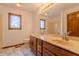 Bathroom featuring a double vanity and marble-look flooring at 13797 Mill Stream Ct, Carmel, IN 46032