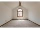 Upstairs bedroom with vaulted ceiling and an arched window at 13797 Mill Stream Ct, Carmel, IN 46032