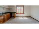 Bright room with a window and wooden cabinets and shelves at 13797 Mill Stream Ct, Carmel, IN 46032