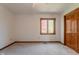 Bright bedroom with carpet and a window overlooking trees at 13797 Mill Stream Ct, Carmel, IN 46032
