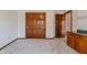 Bedroom featuring carpet, a closet, and wooden doors at 13797 Mill Stream Ct, Carmel, IN 46032