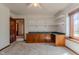 Carpeted bonus room with built-in counter and shelves, and a view to the yard at 13797 Mill Stream Ct, Carmel, IN 46032