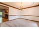 Empty dining room featuring neutral walls, carpet and wood trim at 13797 Mill Stream Ct, Carmel, IN 46032