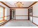 Empty dining room with carpet and trim, neutral wall color at 13797 Mill Stream Ct, Carmel, IN 46032
