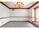 Empty dining room featuring neutral walls, carpet and trim at 13797 Mill Stream Ct, Carmel, IN 46032