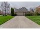 Inviting home featuring a wide driveway, a two-car garage, and beautifully manicured landscaping at 13797 Mill Stream Ct, Carmel, IN 46032