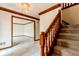Inviting foyer with stairway and tile floor leading into carpeted room at 13797 Mill Stream Ct, Carmel, IN 46032