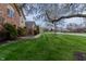 Lush green lawn and mature trees frame this beautiful home, creating a welcoming atmosphere at 13797 Mill Stream Ct, Carmel, IN 46032