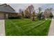 Charming house with lush green lawn, mature trees, and a well-maintained sidewalk at 13797 Mill Stream Ct, Carmel, IN 46032