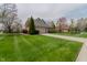 Spacious home with a well-kept lawn, mature landscaping, and a convenient two-car garage at 13797 Mill Stream Ct, Carmel, IN 46032