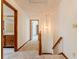 Hallway with stairs leading to the second level at 13797 Mill Stream Ct, Carmel, IN 46032