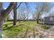 Expansive backyard with mature trees provides ample space for outdoor activities and entertainment at 1409 S Kiel Ave, Indianapolis, IN 46241