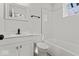 Bright bathroom featuring subway tile shower, modern vanity, and updated fixtures at 1409 S Kiel Ave, Indianapolis, IN 46241